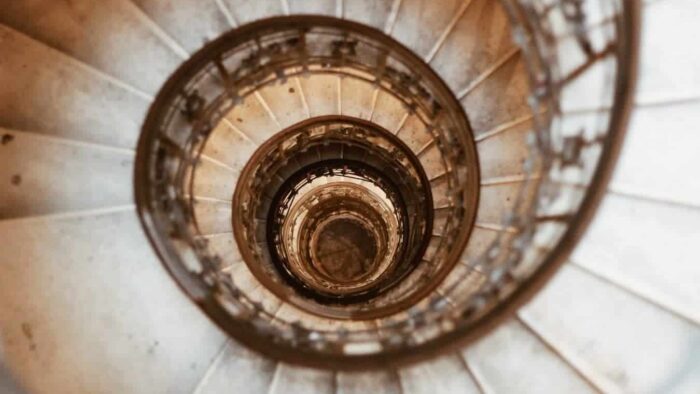 top-view of gray concrete spiral stairway